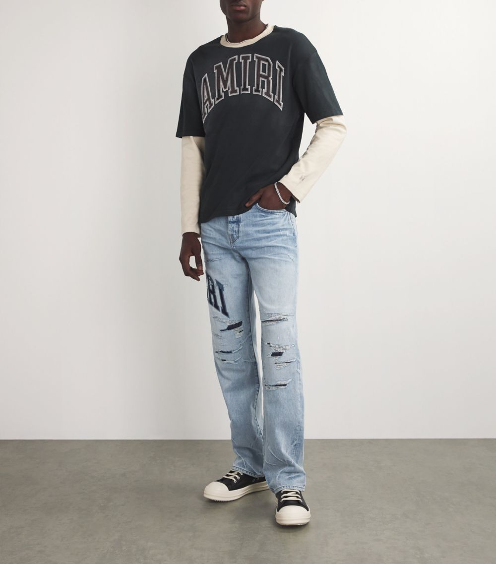 Amiri Amiri Varsity Logo Repaired Jeans